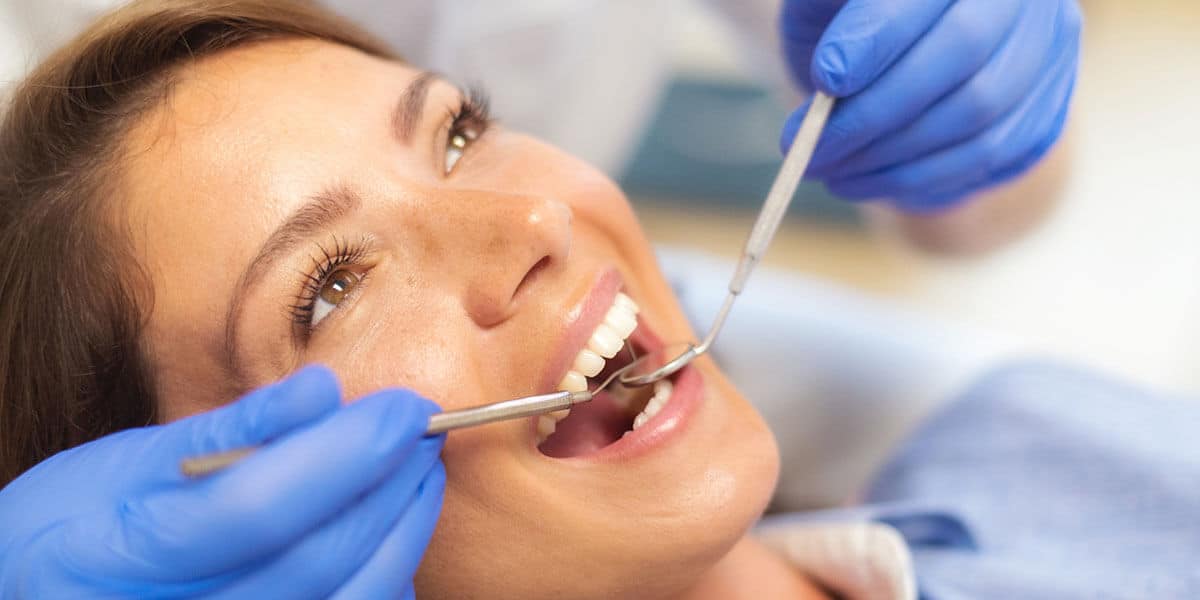 woman in dental chair exam